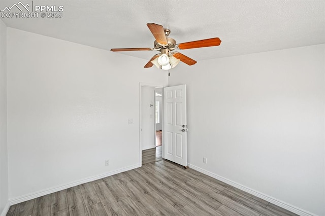 9775 Indian Village Hts, Fountain, CO 80817 - empty room with wood finished floors, baseboards, and ceiling fan
