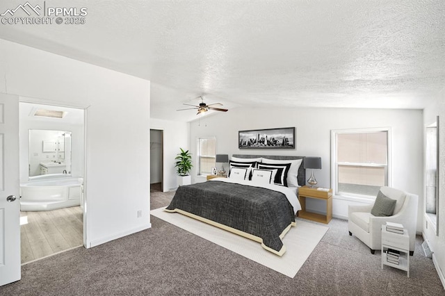 9775 Indian Village Hts, Fountain, CO 80817 - bedroom with lofted ceiling, a textured ceiling, carpet flooring, baseboards, and ensuite bathroom