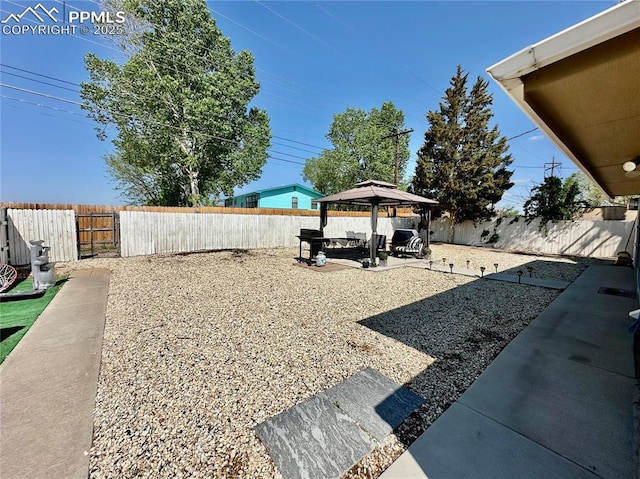 1701 Jerry Murphy Rd, Pueblo, CO 81001 - fenced backyard featuring a gazebo and a patio area