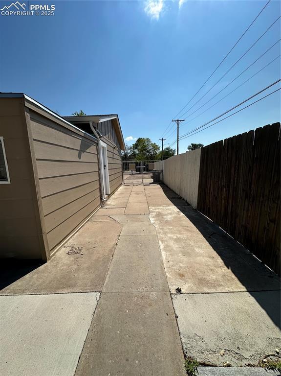 1701 Jerry Murphy Rd, Pueblo, CO 81001 - view of side of home with fence