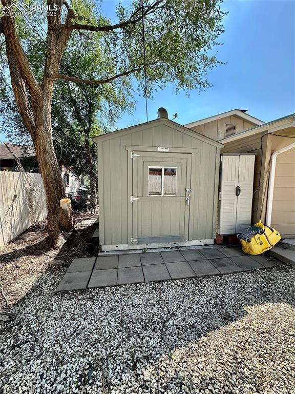 1701 Jerry Murphy Rd, Pueblo, CO 81001 - view of shed featuring fence and a garage