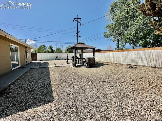 1701 Jerry Murphy Rd, Pueblo, CO 81001 - fenced backyard featuring a gazebo and a patio area