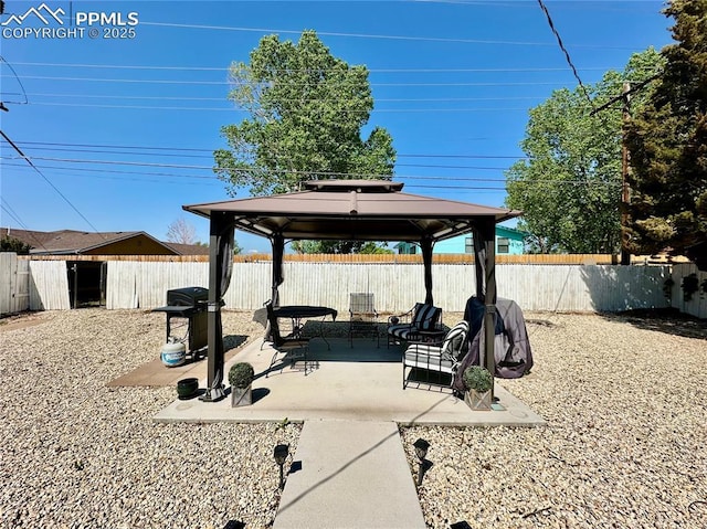 1701 Jerry Murphy Rd, Pueblo, CO 81001 - view of patio / terrace with a gazebo, a fenced backyard, and a grill