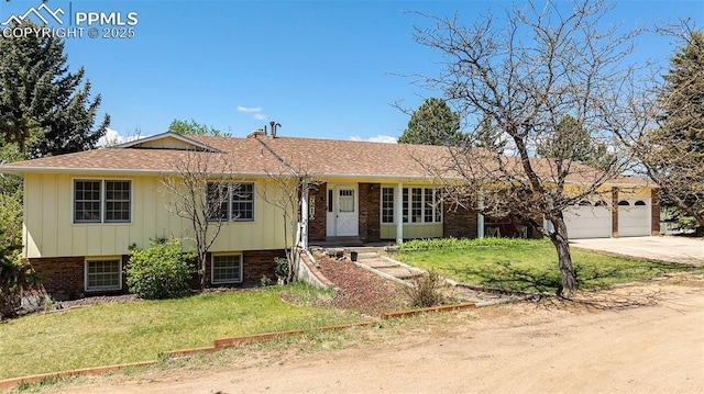 7210 Antelope Ln, Colorado Springs, CO 80920 - view of front facade with concrete driveway, a front yard, an attached garage, brick siding, and board and batten siding