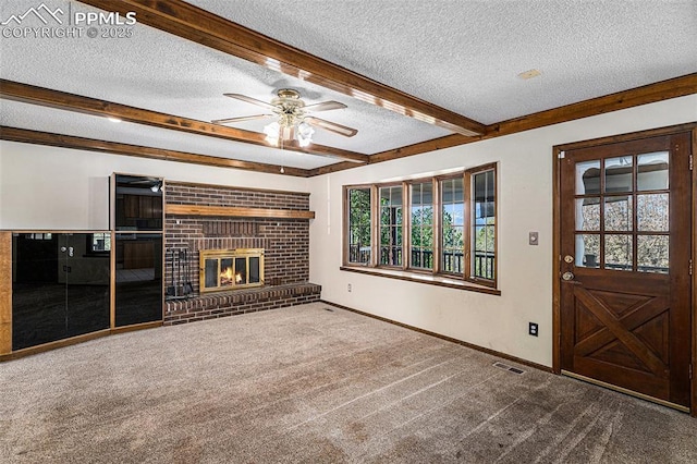 7210 Antelope Ln, Colorado Springs, CO 80920 - unfurnished living room featuring a textured ceiling, a ceiling fan, carpet floors, beam ceiling, and baseboards
