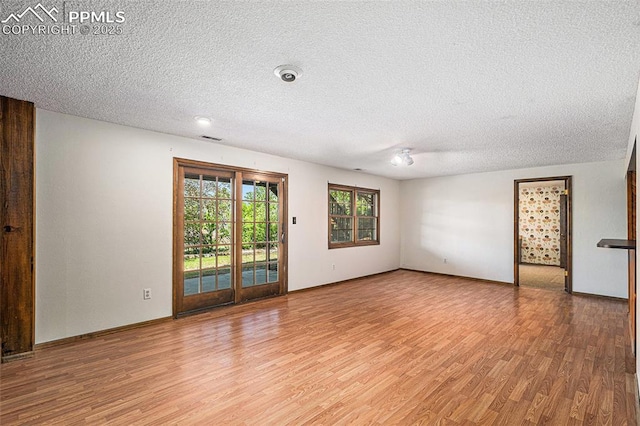 7210 Antelope Ln, Colorado Springs, CO 80920 - empty room with light wood-type flooring and a textured ceiling