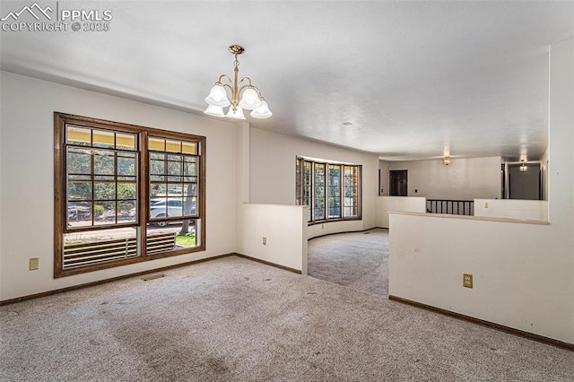 7210 Antelope Ln, Colorado Springs, CO 80920 - carpeted spare room with a chandelier and baseboards