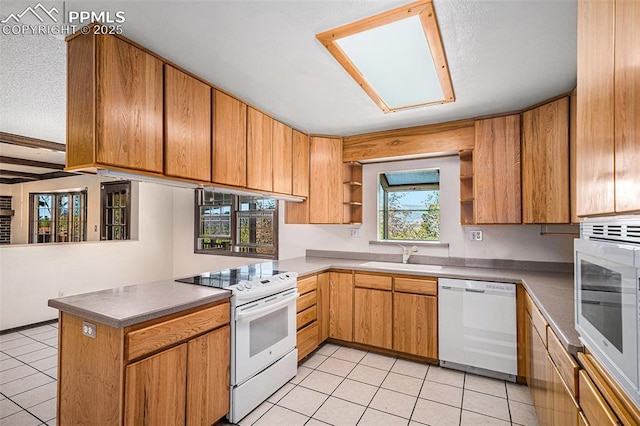 7210 Antelope Ln, Colorado Springs, CO 80920 - kitchen with white appliances, open shelves, a peninsula, a sink, and light tile patterned floors
