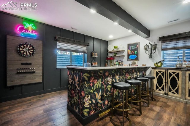 indoor bar featuring hardwood / wood-style floors and recessed lighting