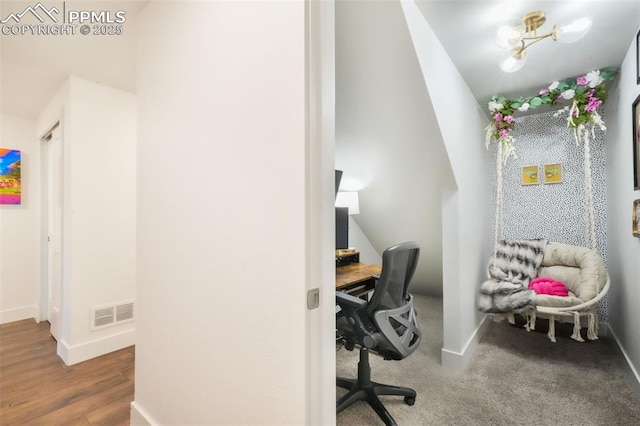 office area with baseboards and wood finished floors