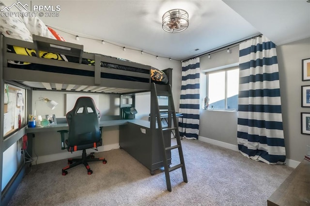 bedroom featuring carpet flooring and baseboards