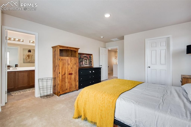 16470 Mountain Flax Dr, Monument, CO 80132 - bedroom with light carpet, connected bathroom, recessed lighting, and a sink