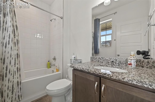 bathroom with shower / bath combination with curtain, toilet, and vanity