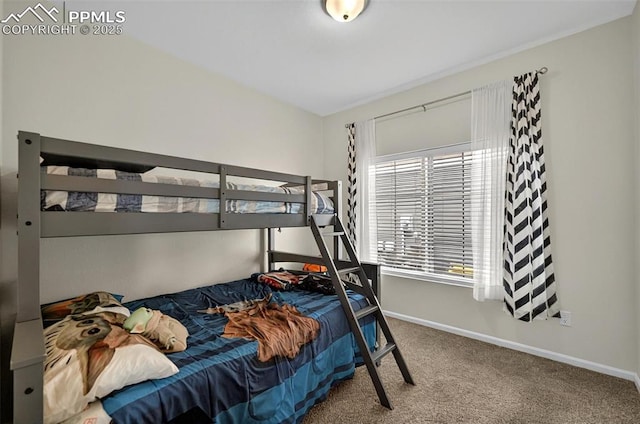 bedroom with carpet flooring and baseboards