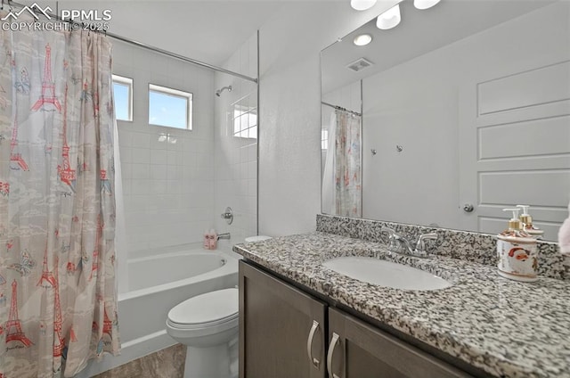 bathroom featuring shower / bath combination with curtain, toilet, wood finished floors, and vanity