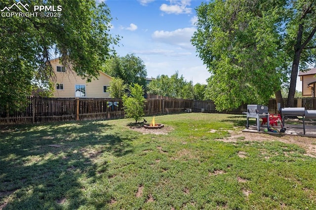 604 Blossom Field Rd, Fountain, CO 80817 - view of yard with an outdoor fire pit