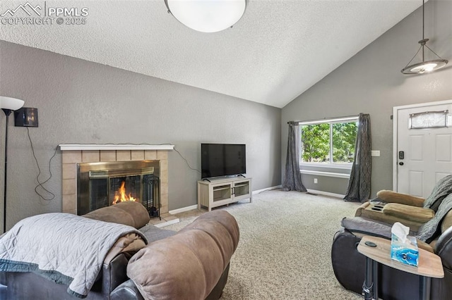 604 Blossom Field Rd, Fountain, CO 80817 - living area featuring a fireplace, a textured ceiling, carpet, baseboards, and high vaulted ceiling