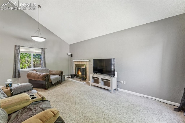 604 Blossom Field Rd, Fountain, CO 80817 - living room with carpet, a tile fireplace, baseboards, and high vaulted ceiling