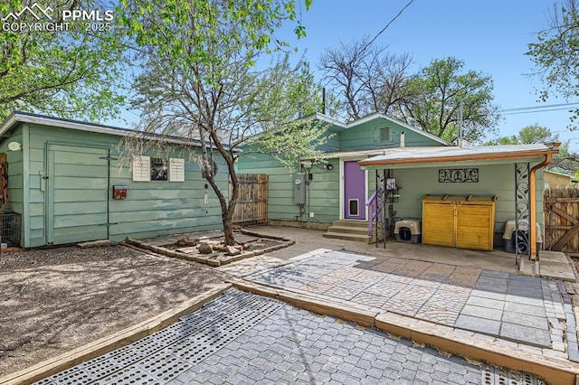 319 S Institute St, Colorado Springs, CO 80903 - back of house with entry steps, a patio area, fence, and a gate