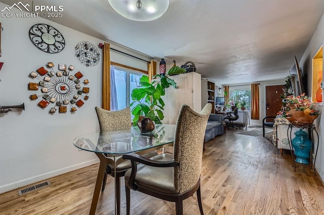 319 S Institute St, Colorado Springs, CO 80903 - dining room featuring wood finished floors and baseboards