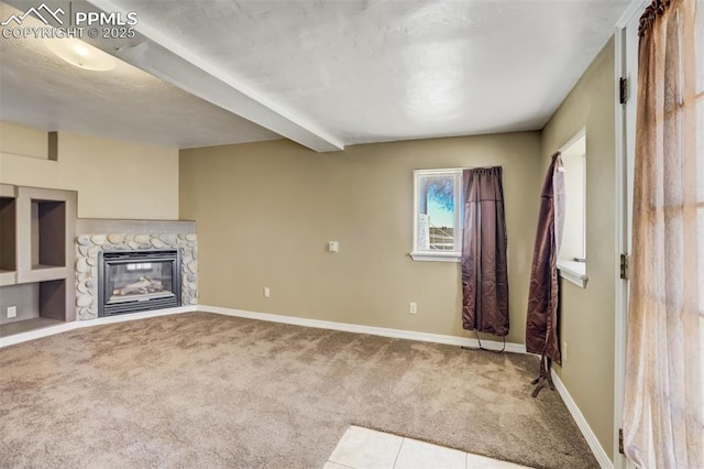 1475 S Peyton Hwy, Calhan, CO 80808 - unfurnished living room featuring carpet flooring, a stone fireplace, and baseboards