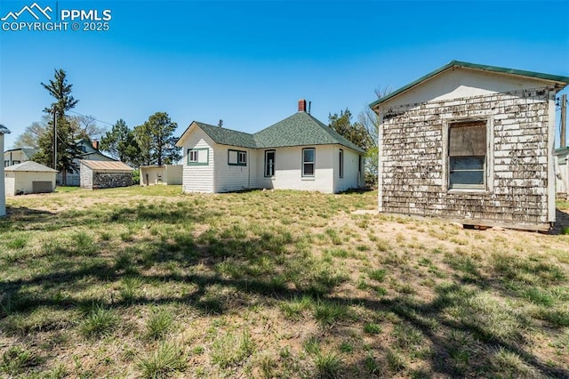 1475 S Peyton Hwy, Calhan, CO 80808 - back of property with a lawn