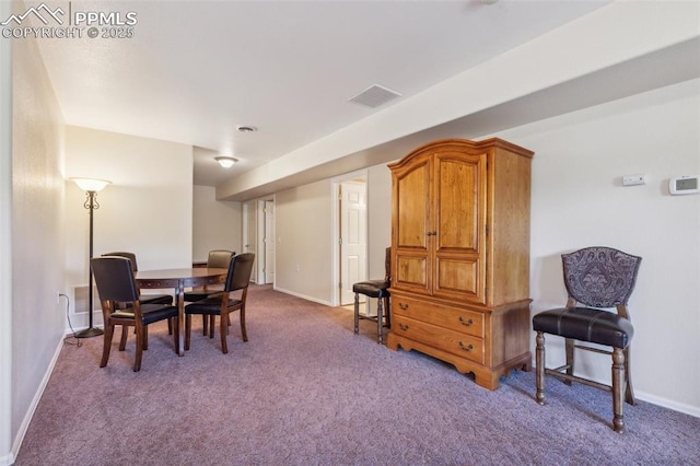 2744 La Strada Grande Hts, Colorado Springs, CO 80906 - carpeted dining area featuring baseboards