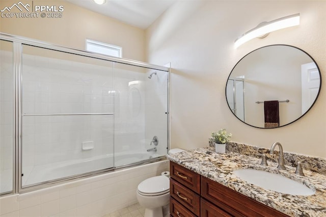 2744 La Strada Grande Hts, Colorado Springs, CO 80906 - full bathroom featuring toilet, vanity, and shower / bath combination with glass door