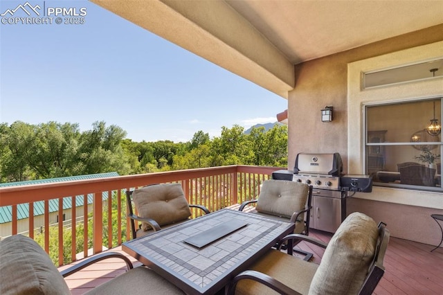 2744 La Strada Grande Hts, Colorado Springs, CO 80906 - wooden terrace with outdoor dining area
