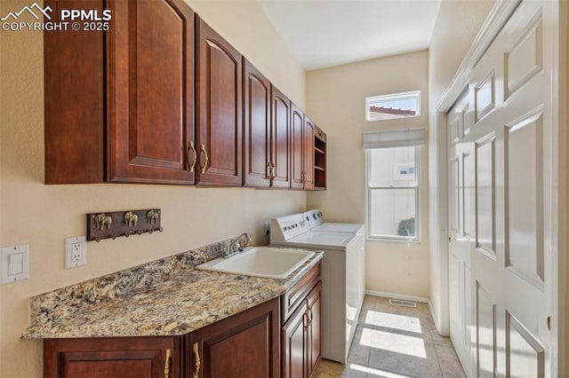 2744 La Strada Grande Hts, Colorado Springs, CO 80906 - laundry area with washer and clothes dryer, cabinet space, and baseboards