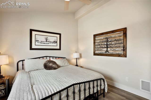 bedroom featuring wood finished floors, baseboards, lofted ceiling, and ceiling fan