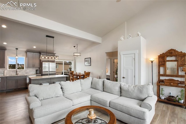 living room with wood finished floors and recessed lighting