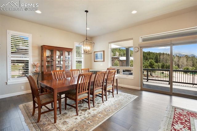 dining area with a chandelier, baseboards, recessed lighting, and dark wood-style floors