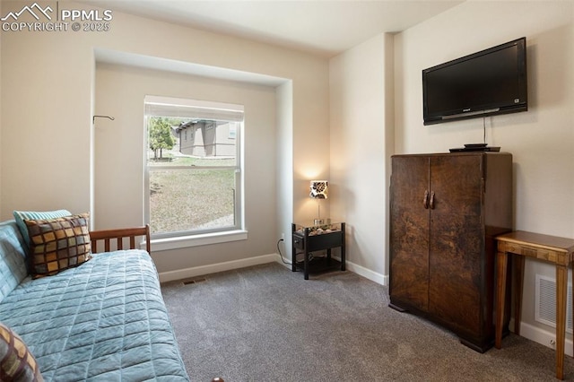 carpeted bedroom featuring baseboards