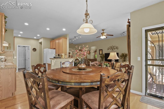 dining space featuring light wood-style flooring, ceiling fan, recessed lighting, plenty of natural light, and baseboards
