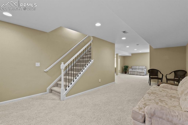 living area with baseboards, carpet, stairs, and recessed lighting