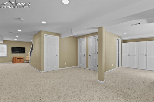 below grade area with carpet floors, baseboards, and recessed lighting