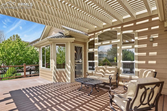sunroom with an outdoor living space