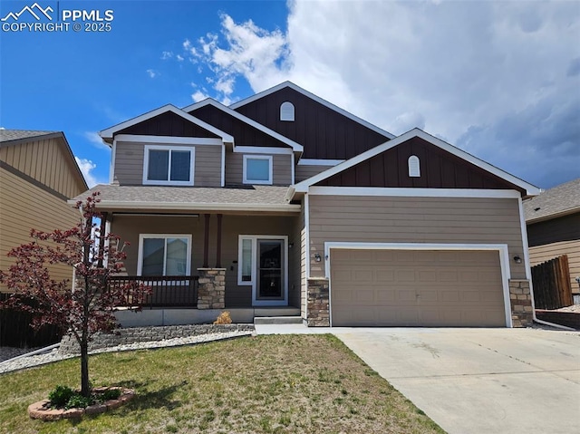 craftsman-style home with a porch, board and batten siding, stone siding, concrete driveway, and an attached garage