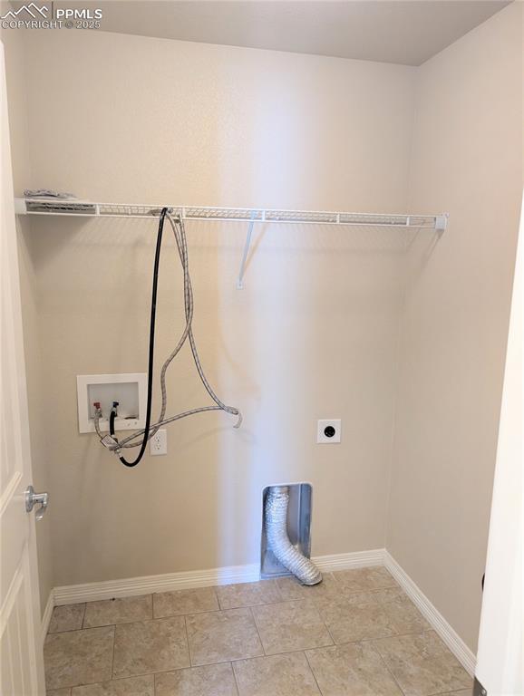 laundry room with washer hookup, hookup for an electric dryer, and baseboards