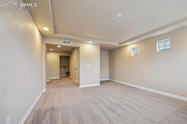 8451 Meadow Wing Cir, Colorado Springs, CO 80927 - unfurnished room featuring a tray ceiling, recessed lighting, light colored carpet, and baseboards