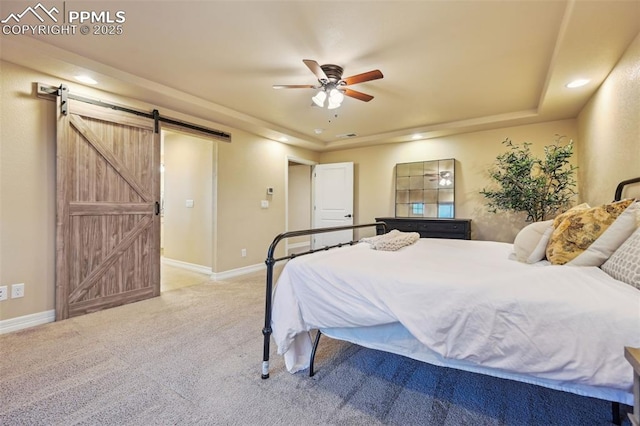 8451 Meadow Wing Cir, Colorado Springs, CO 80927 - bedroom featuring a barn door, light carpet, recessed lighting, baseboards, and ceiling fan