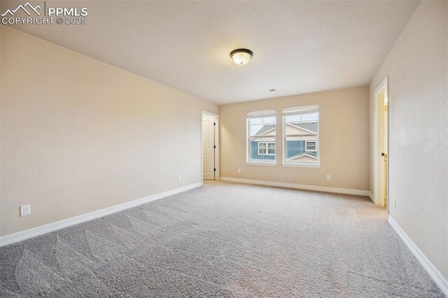 8451 Meadow Wing Cir, Colorado Springs, CO 80927 - spare room featuring carpet flooring and baseboards