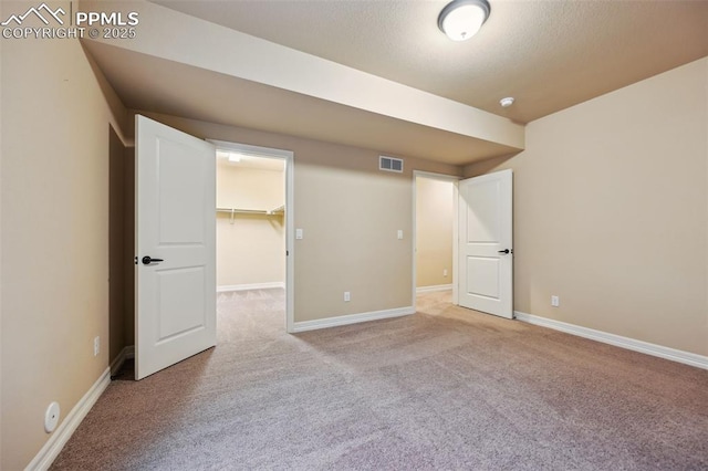 8451 Meadow Wing Cir, Colorado Springs, CO 80927 - unfurnished bedroom with carpet floors, a spacious closet, baseboards, and a closet