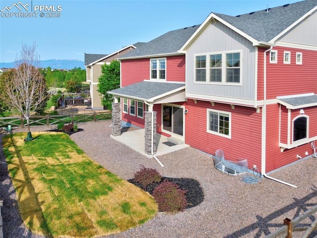 8451 Meadow Wing Cir, Colorado Springs, CO 80927 - back of house with a patio and roof with shingles
