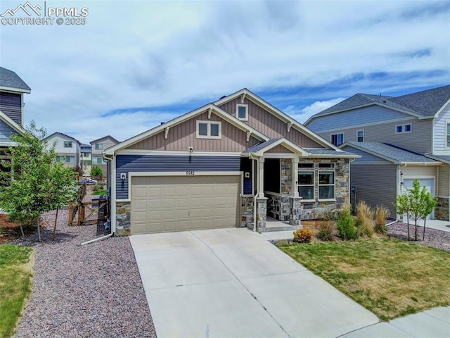 craftsman inspired home with stone siding, board and batten siding, an attached garage, concrete driveway, and covered porch