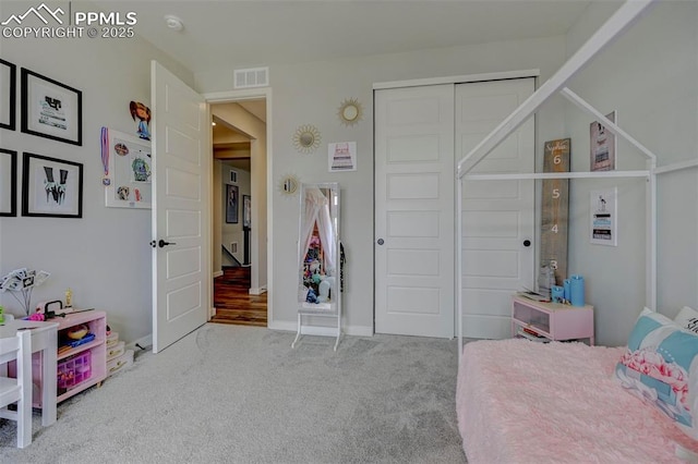 carpeted bedroom with a closet