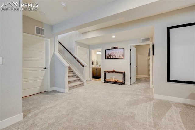 stairway featuring carpet floors, baseboards, and recessed lighting