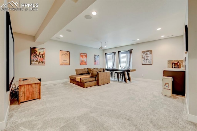 living area with carpet floors, baseboards, and recessed lighting