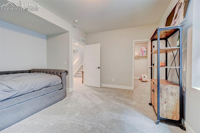 bedroom featuring carpet flooring and baseboards